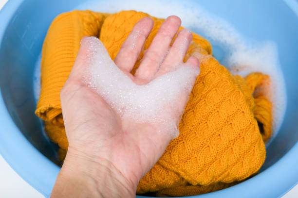 istock Hand washing of delicate woolen knitted clothes, sweaters concept 1434743535