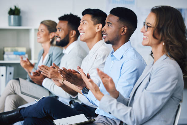 istock Applause, support and success with a team of business people clapping during a presentation, meeting or seminar in the office. Teamwork, motivation and goal with a crowd in celebration of achievement 1434743871