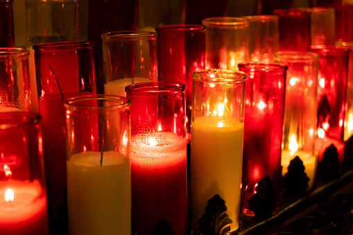A glimpse at vigil lights in a church.