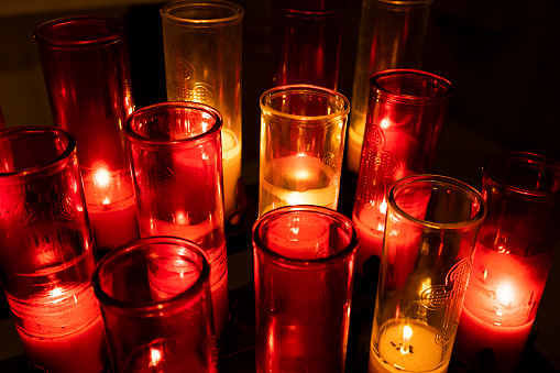 A glimpse at vigil lights in a church.