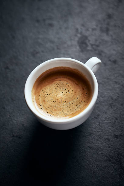 istock Cup of coffee on dark stone background. Close up. Copy space. 1434744791