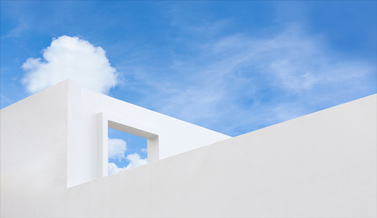 Wall texture of concrete with open window against blue sky and clouds, A part of White cement building, Anyt view Modern architecture. with summer sky, Minimalistic design