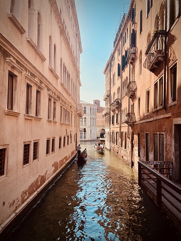 View of residential buildings and gondolas in one of the canals of Venice, Italy