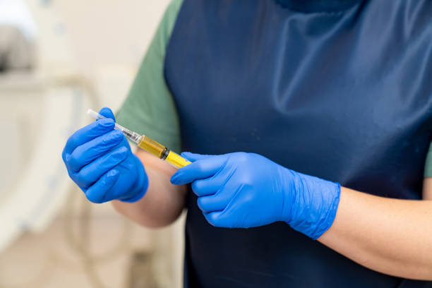 istock Injection prepairing in gloved hands. Hospital syringe laboratory researching. 1434753438