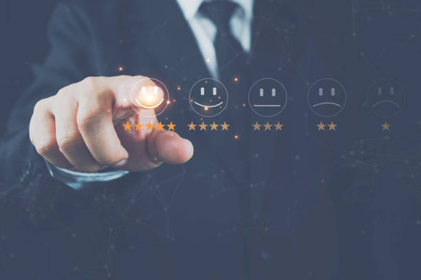 istock Businessman presses a smiley face emoticon on a virtual touch screen. Customer Service Assessment Concept. 1434755337