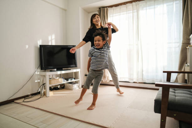 istock Mother and boy dancing together 1434756844