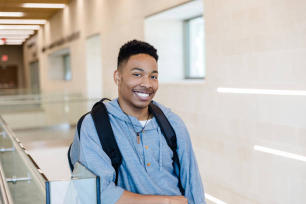 istock Young adult male smiles for camera 1434757066