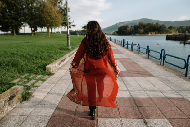 istock Young woman wearing a red cloak 1434757395
