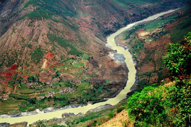 The scenery from the hiking trail. The Jinsha River is the upper and trunk of the Yangtze River. Photographic slide photo  in Jul 2003, Lijiang, Yunnan