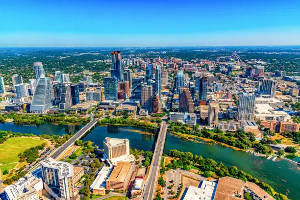 Aerial view of the buildings along the banks of the Colorado River in downtown Austin, Texas from about 1200 feet in altitude during a helicopter photo flight.