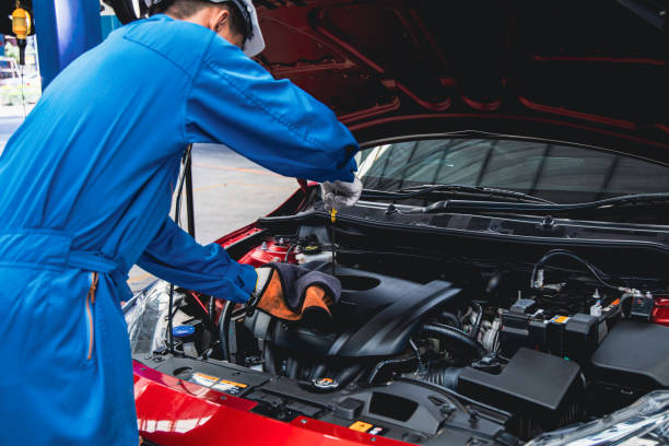 istock Mechanic pulling out the dipstick to check the engine oil level. 1434767832