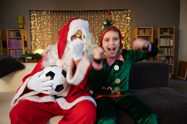 istock Santa Claus and his elf 1434771693