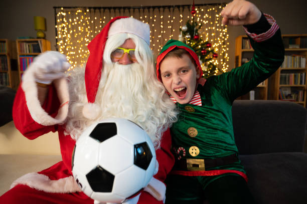 istock Santa Claus and his elf 1434771811