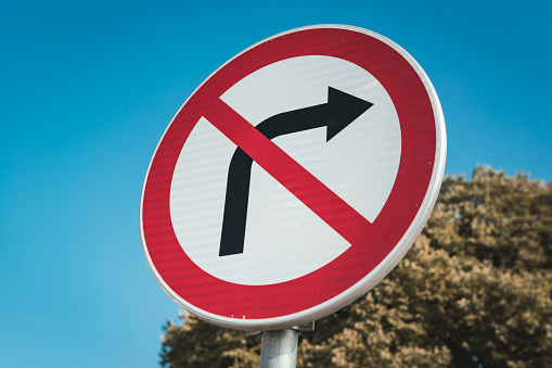 A no left turn sign isolated on white. From Portugal.