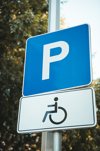 Road sign indicating a parking area reserved for the disabled