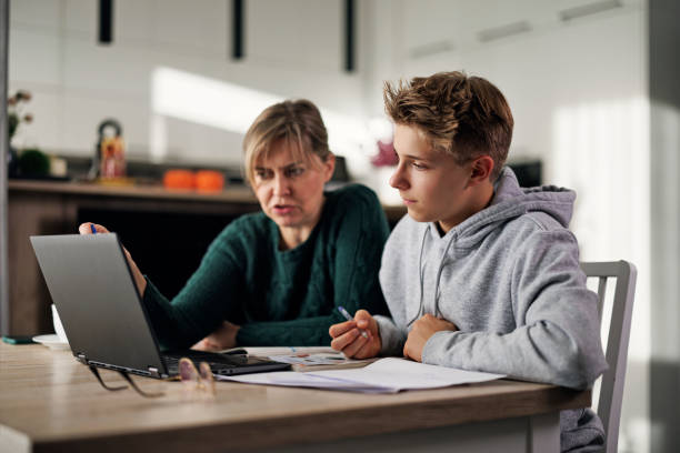 Mother helping son with some homework