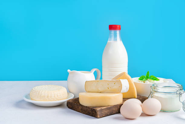 istock Dairy products and eggs on a blue background. Different kinds of cheese, milk, cream and eggs on a blue background. 1434777220