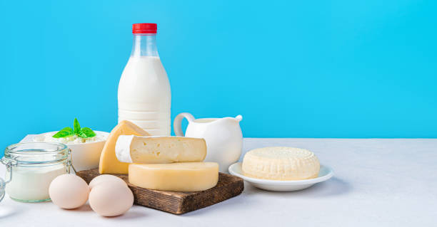 istock Cheese, dairy products and eggs on a blue background. 1434777556