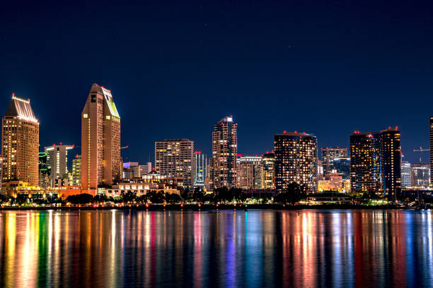 Downtown Skyline across the Bay Vibrant and colorful Downton San Diego with beautiful reflections over San Diego Bay san diego stock pictures, royalty-free photos & images