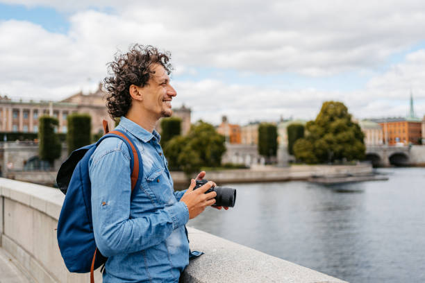 istock Young Tourist Holding A Camera On The Quayside 1434779114