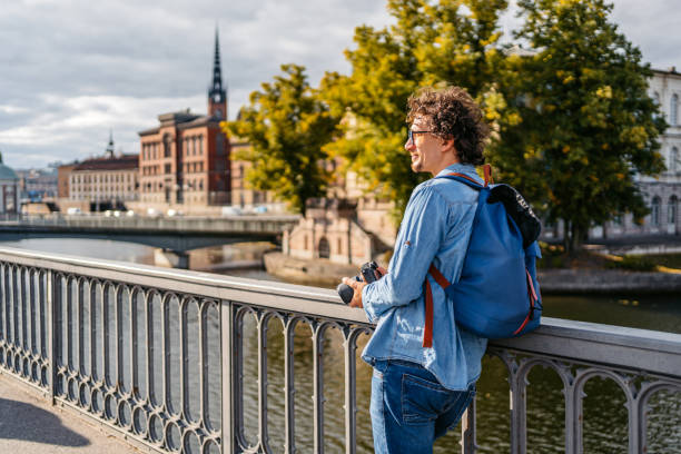 istock Young Tourist Holding A Camera On The Quayside 1434779137