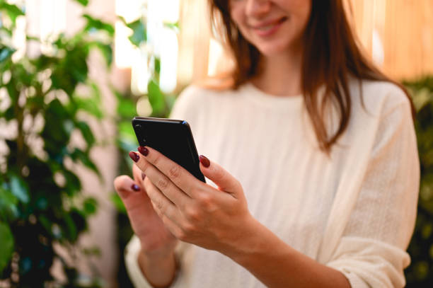 istock Technology and people concept. Scrolling social media. Selective focus hands with the smart phone. 1434780098