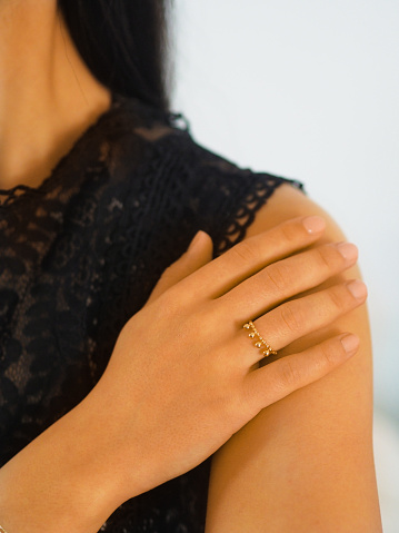Gold rings accumulation on a woman hand