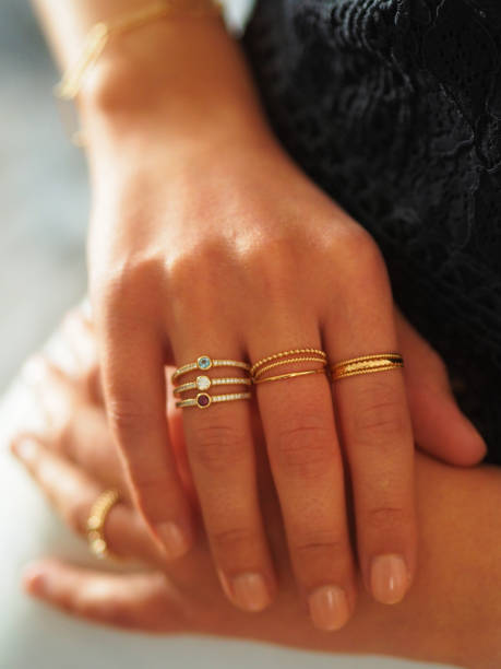 istock Gold rings accumulation on a woman hand 1434780784