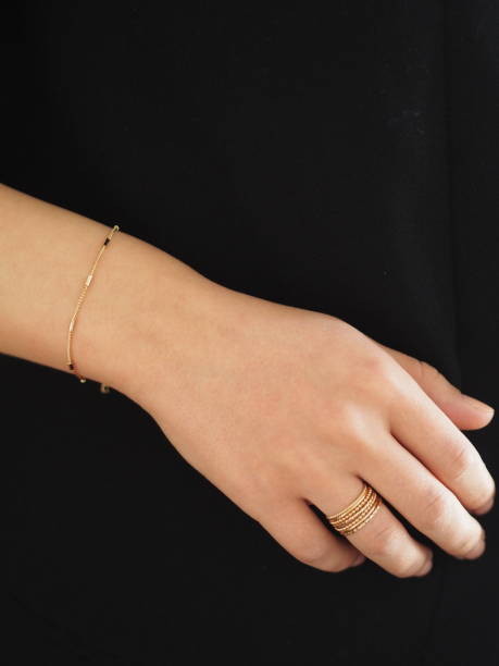 istock Gold bracelet and ring on a woman wrist 1434780800