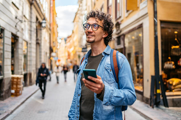 istock Young Tourist Using A Map On A Smart Phone 1434780912
