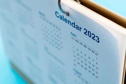 2023 calendar on the desk.