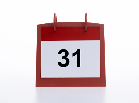 the thirteenth day of the month highlighted on the calendar with a red frame close-up macro, the mark on the calendar, the thirteenth date