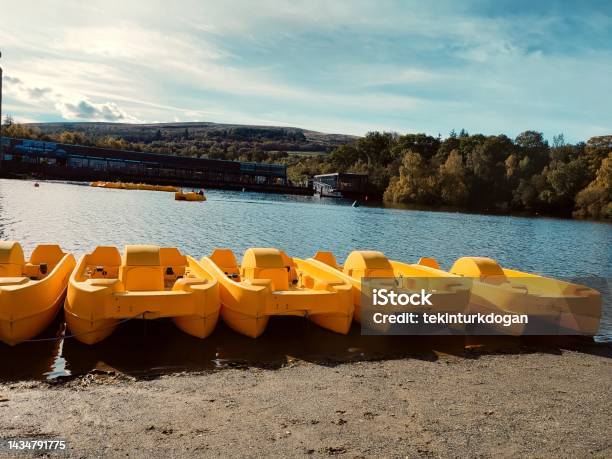 Leisure Boats And Canoes At Coast Of Loch Lomond Natural Park At Balloch Glasgow Scotland England Uk Stock Photo - Download Image Now