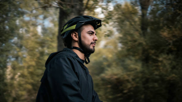 istock Man riding a bike in the forest 1434792620