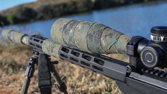 Close up of a hunting rifle and scope