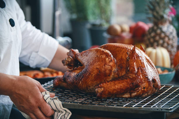istock Preparing Stuffed Turkey for Holidays in Domestic Kitchen 1434797608