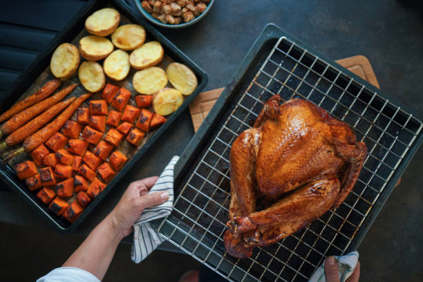 istock Preparing Stuffed Turkey for Holidays in Domestic Kitchen 1434797636