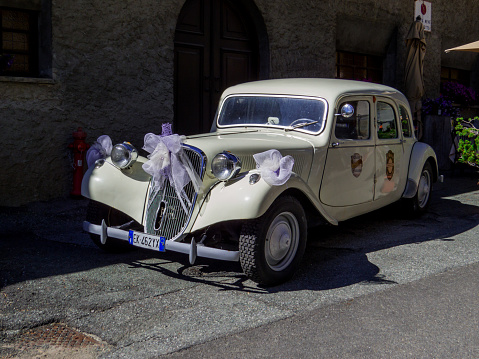 Cervinia, Italy - July 31, 2022: Vintage bride's car in the old town.