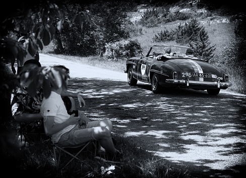 urbino, Italy – June 16, 2022: MERCEDES-BENZ 190 SL 1957 on an old racing car in rally Mille Miglia 2022 the famous italian historical race (1927-1957