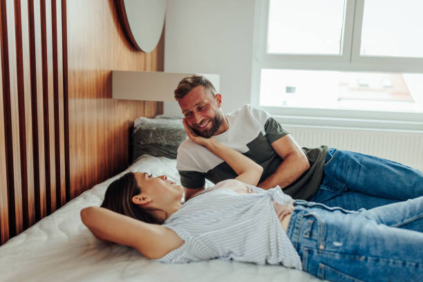 istock Romantic couple lying in bedroom. 1434803619
