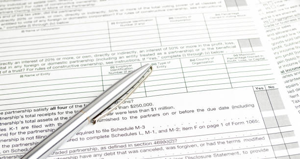 istock tax forms and pen with calculator. Tax concept 1434804470