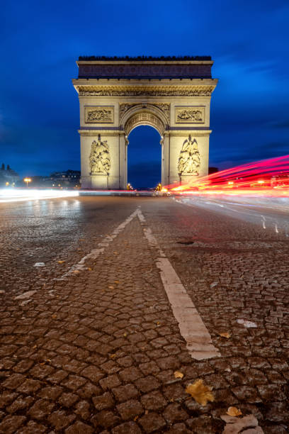 istock Long exposure along Champs Elysee with Arc de Triomphe in background of light trails 1434805440