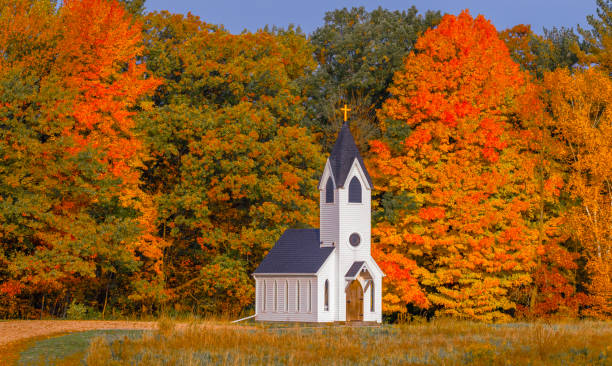 istock Autumn colorful trees surround little chapel 1434810218