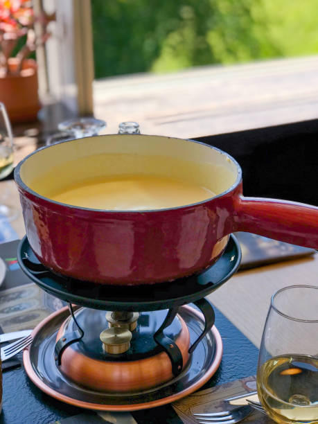 fondue - gruyère, schweiz - gruyeres stock-fotos und bilder