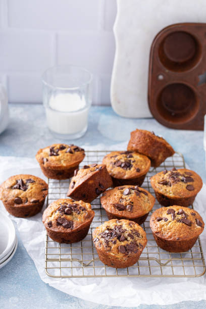 istock Banana chocolate chip muffins on a baking rack, breakfast or snack idea 1434816124