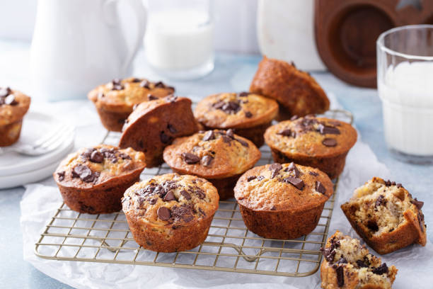 istock Banana chocolate chip muffins on a baking rack, breakfast or snack idea 1434816129