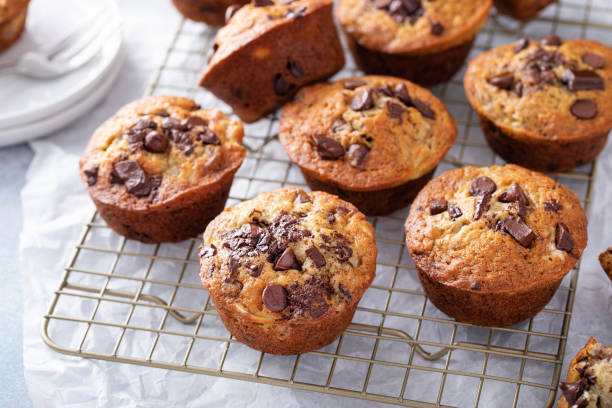 istock Banana chocolate chip muffins on a baking rack, breakfast or snack idea 1434816151
