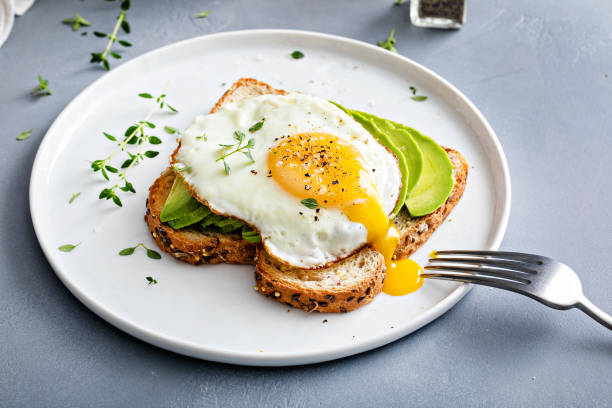 istock Avocado toast on a toasted multigrain bread with a fried egg 1434816219