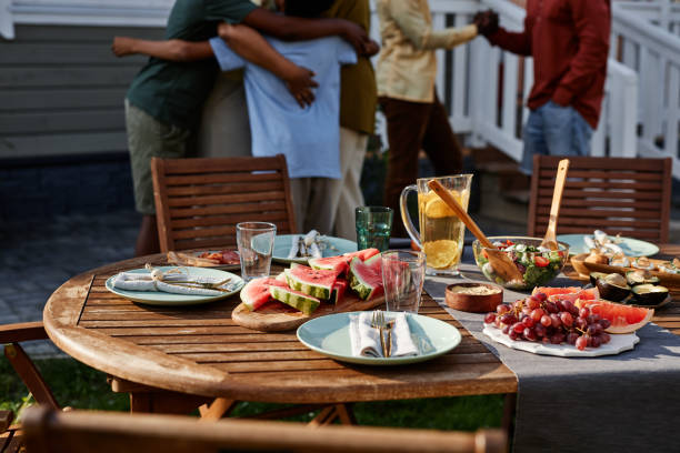 istock Family Dinner Outdoors in Summer 1434816474
