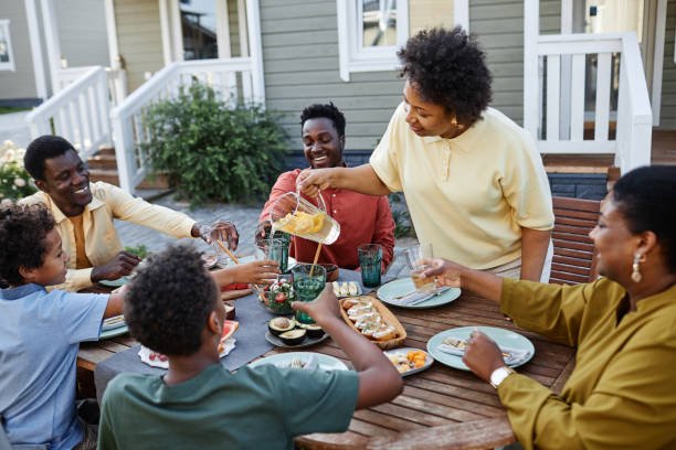 Black Woman Hosting Family Dinner